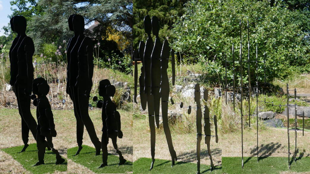 Metal silhouette sculptures of a family—two adults and a child—shown from two angles, demonstrating how the flat black figures appear solid from one view but nearly disappear when seen edge-on.